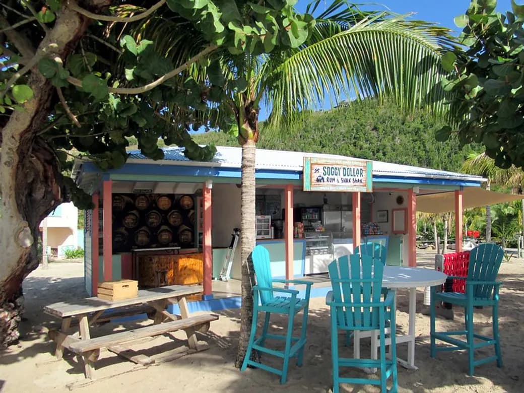 Traditional Grenadian rum shop with wooden bar and local atmosphere